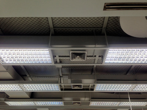 Air grille and lighting system. Ducting for air conditioner. System work on the floor.