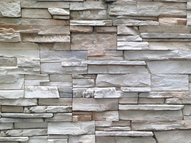 istock Stone background walls are stacked. Stone cladding background and wallpaper. 1163186107