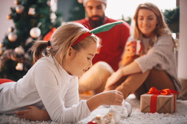 istock Family celebrating Christmas at home. 1163186596