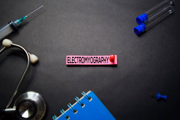 istock Electromyography text on Sticky Notes. Top view isolated on black background. Healthcare/Medical concept 1163190044