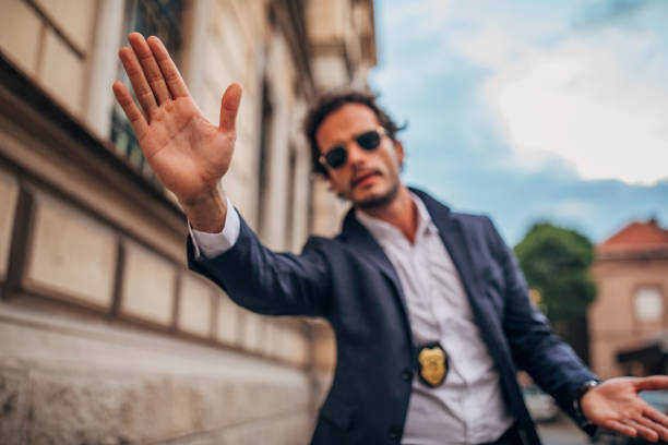istock Detective standing on the street 1163190971