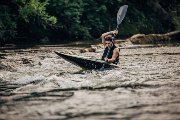 istock Woman in a kayak sails on a mountain river 1163191309
