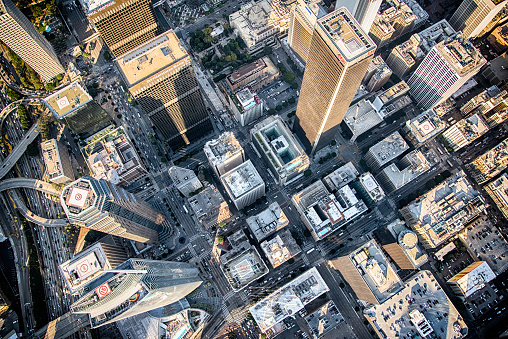 The city streets of downtown Los Angles, arranged in a grid pattern, shot from directly overhead from an altitude of about 2000 feet.