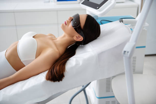 istock Relaxed lady on couch in laser cosmetic center 1163194171