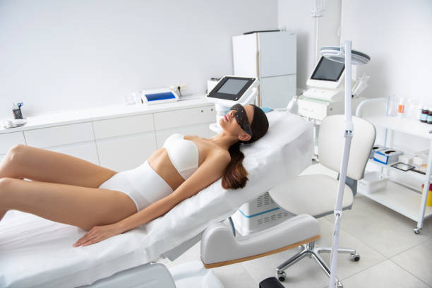 istock Beautiful lady on couch in laser cosmetic center 1163194182