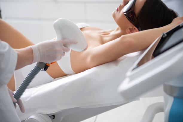 istock Slender lady on armpit laser epilation procedure 1163194205