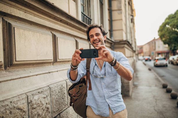 istock Man photographing in the city 1163194802