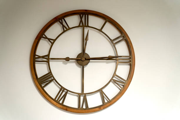 istock Modern metal and wood wall watch 1163196100