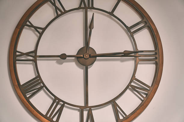 istock Modern metal and wood wall watch 1163196102