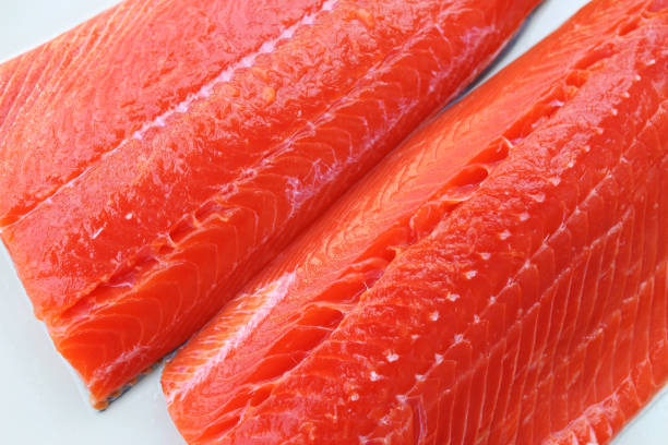 Sockeye salmon fillets on a white background