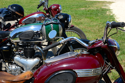 details of vintage motorcycles taken at a meeting on a public road