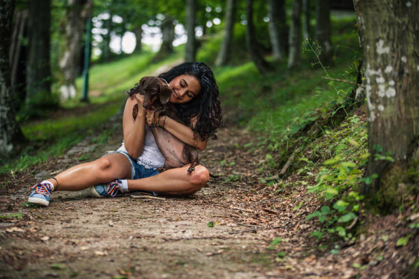 istock Young woman with dog 1163199067