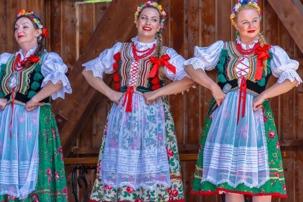 Mature women dancers from Poland in traditional costume Timisoara: Mature women dancers from Poland in traditional costume perform at the international folk festival International Festival of hearts organized by the City Hall. floral crown photos stock pictures, royalty-free photos & images