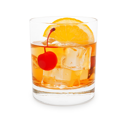 Old-fashioned cocktail with cherry and orange slice isolated on white