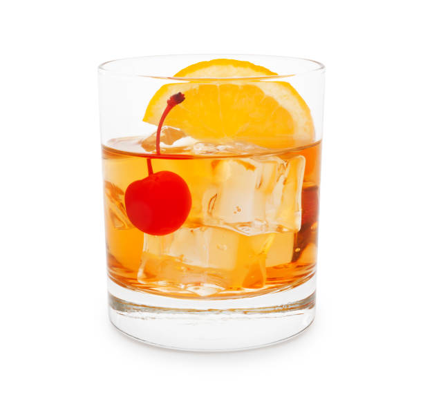 Old-Fashioned Cocktail Old-fashioned cocktail with cherry and orange slice isolated on white maraschino cherry stock pictures, royalty-free photos & images