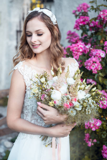istock Portrait of a beautiful bride with flowers 1163199533