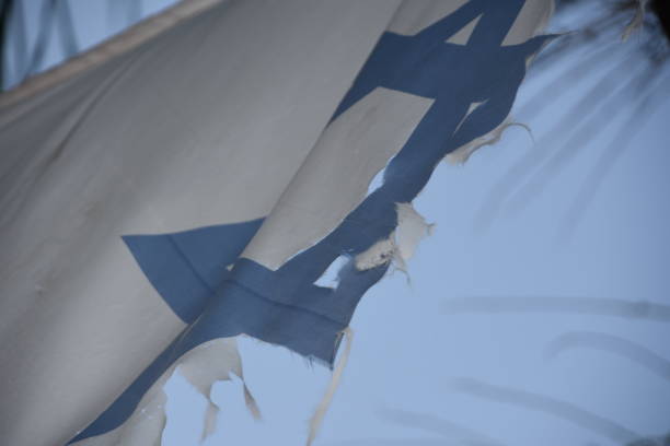 istock The Israeli flag is torn 1163200206