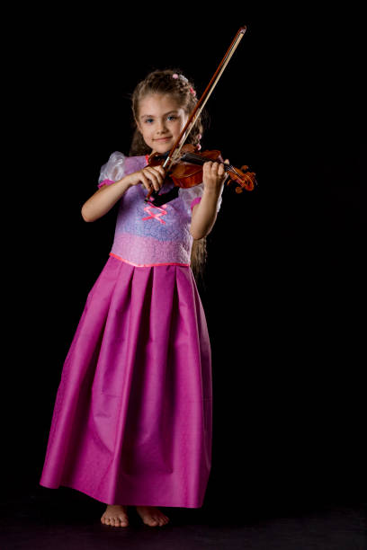 Young happy girl on black background