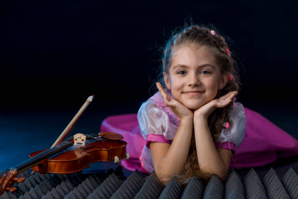 Young happy girl on black background