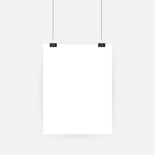istock Set of multicolored binder clips on a piece of paper on a transparent background. Clerical clothespin on a transparent background 1163206037