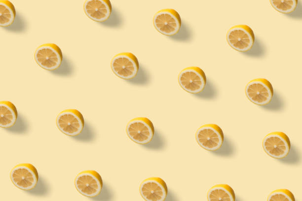 Summer exotic pattern with sliced lemon on the minimal background stock photo