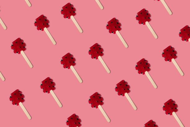 Red candy sweet pattern on the pink minimal background stock photo