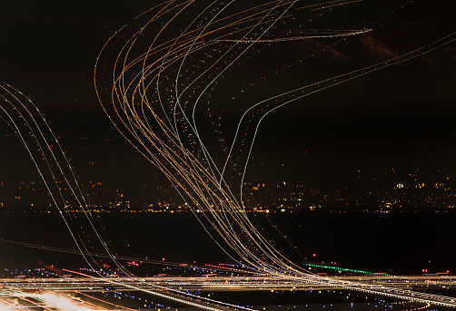 Planes taking off from San Francisco International Airport leave trails behind making for an eyecatching image