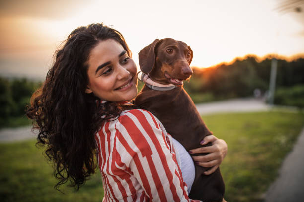 istock Beautiful woman and dachshund 1163219307