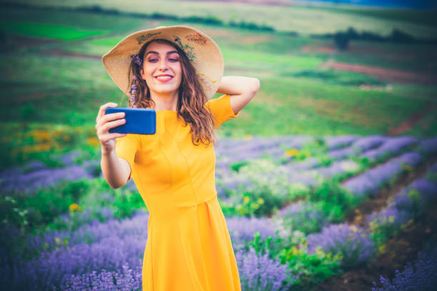 istock Woman taking Selfie in lavender field 1163222067