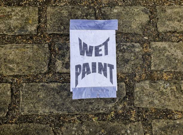 istock Make-shift warning of wet paint close-by 1163222156
