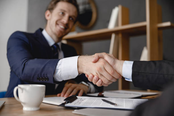 istock Two businessmen shaking hands after making a deal 1163222282