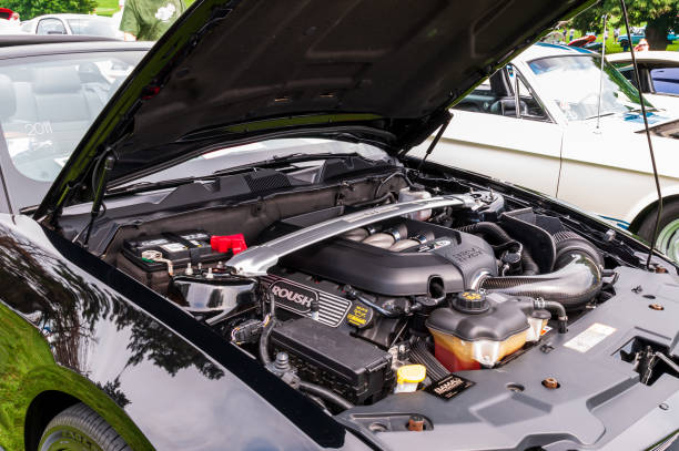 The engine compartment of a Ford Mustang stock photo