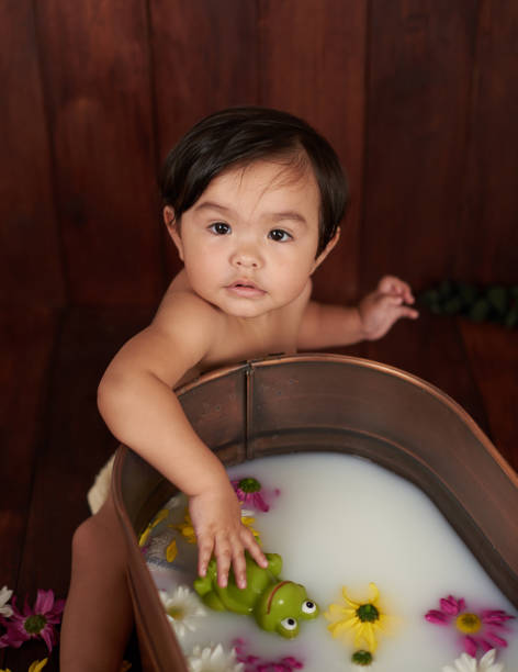 istock Portrait of small girl taking bath 1163226207