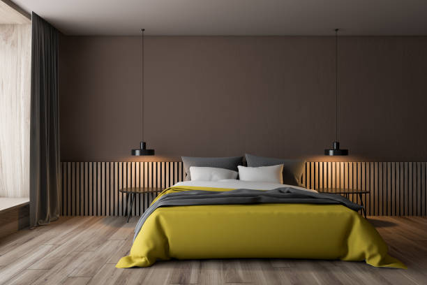 istock Brown bedroom interior with yellow bed 1163227339