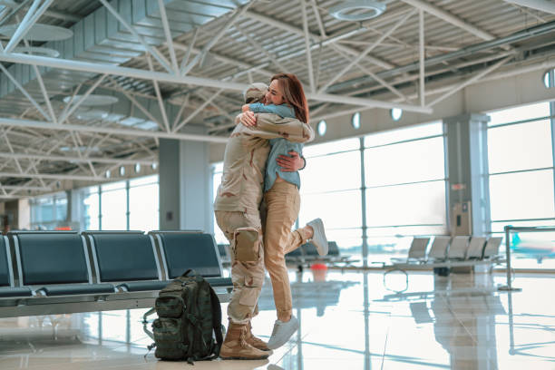 istock Happy young couple hugging each other in big hall 1163228179