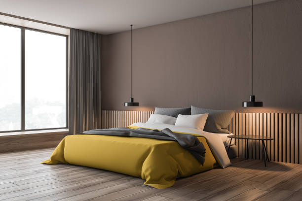 istock Brown bedroom corner with yellow bed 1163228185