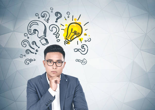 istock Asian businessman in glasses, solution search 1163228237