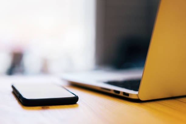 istock Blurry laptop and smartphone 1163229418