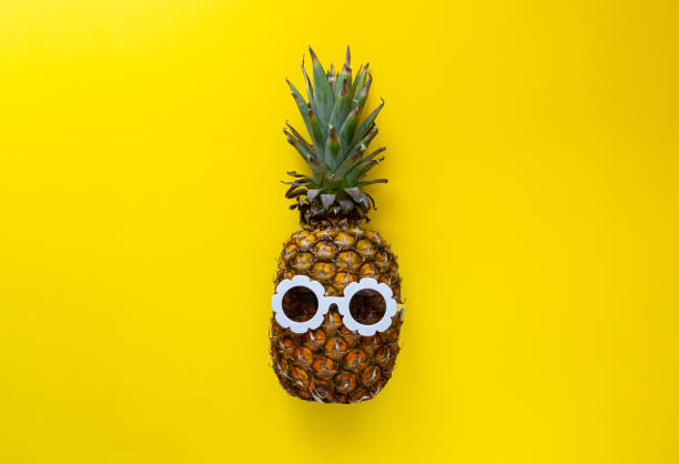 istock Pineapple in White Sunglasses on the Colorful Background, Creative Summer Concept 1163229506