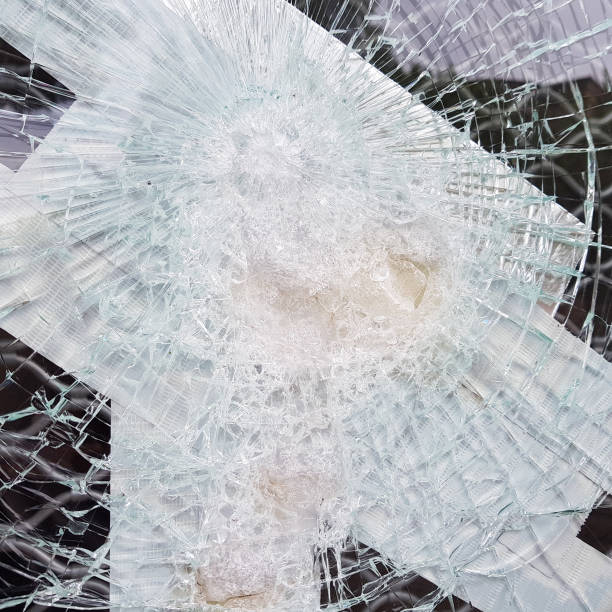 istock Cracked glass showcases with adhesive paper. 1163234530