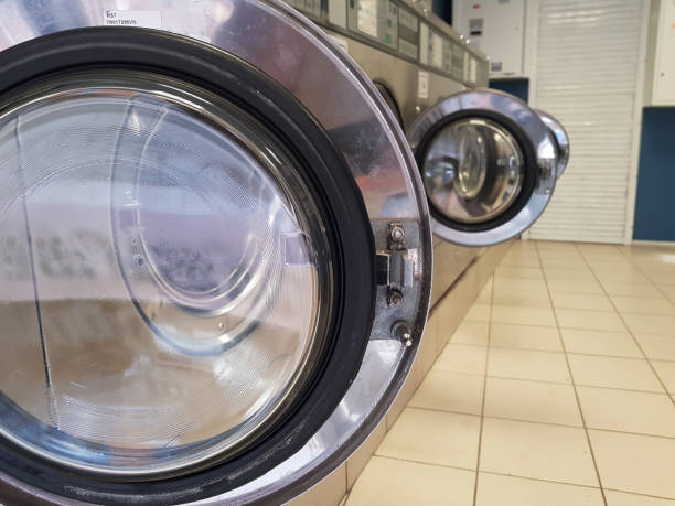 istock open hatches of empty washing machines built in a row 1163234668