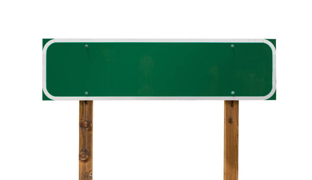 istock Blank Green Road Sign with Wooden Posts Isolated on a White Background 1163235421