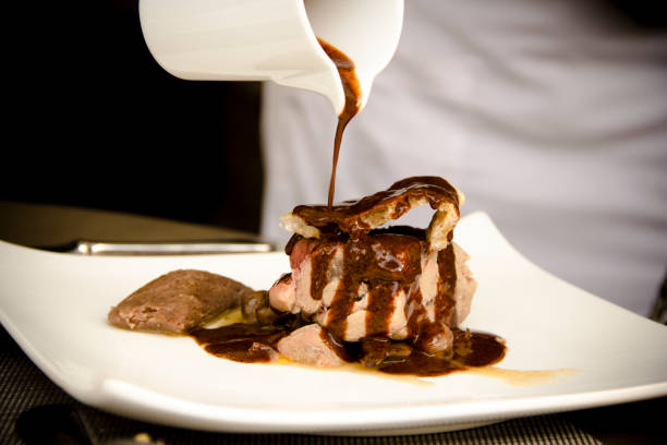 istock Mexican black sauce mole and roasted pork loin 1163235495