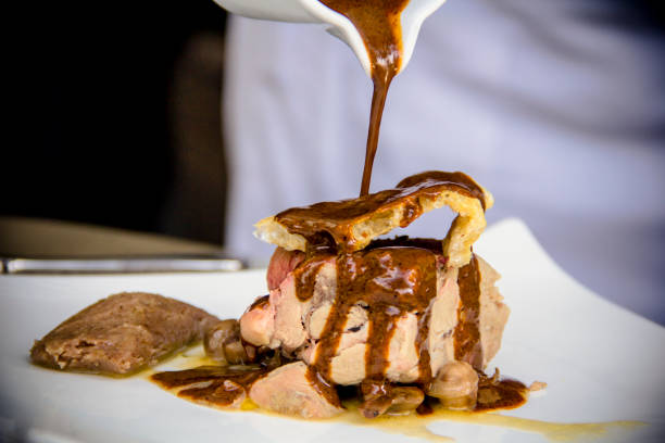 istock Mexican black sauce mole and roasted pork loin 1163237199