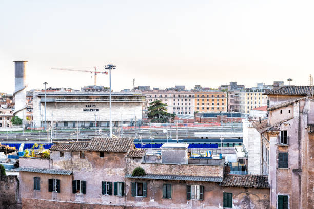 aerial high angle view on roma termini rome main railway station in italy with railroad tracks and passenger trains at sunset aerial high angle view on roma termini rome main railway station in italy with railroad tracks and passenger trains at sunset - roma termini zdjęcia i obrazy z banku zdjęć