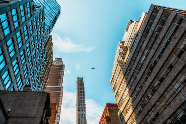 istock Architecture in New York City, Low Angle View, Vanishing Point, Blue Sky Background 1163242114