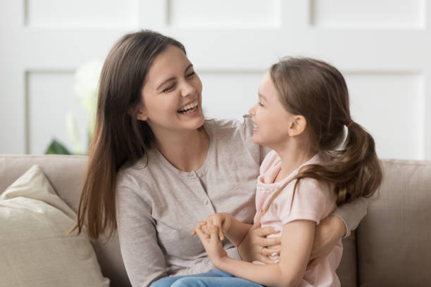 istock Smiling young mom and daughter have fun laughing 1163242800
