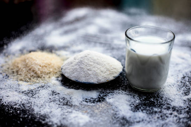 istock Face mask for instant white skin on wooden surface i.e. rice flour well mixed with raw milk in a glass bowl.Some rice flour spread on the surface.Horizontal shot. 1163243123