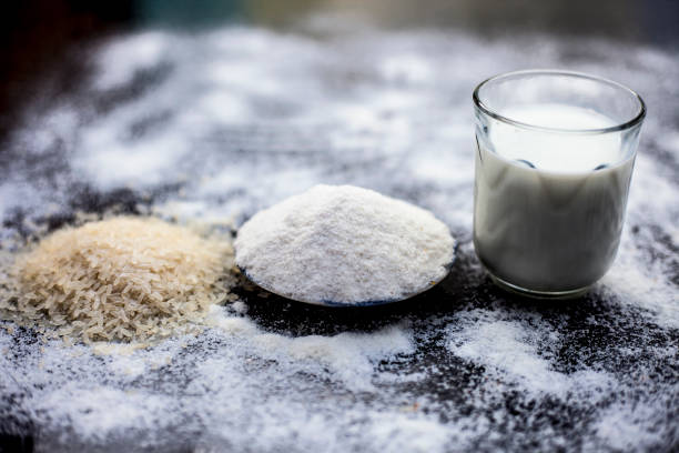 istock Face mask for instant white skin on wooden surface i.e. rice flour well mixed with raw milk in a glass bowl.Some rice flour spread on the surface.Horizontal shot. 1163243124