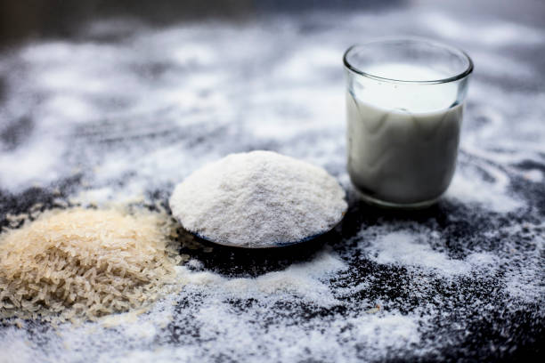 istock Face mask for instant white skin on wooden surface i.e. rice flour well mixed with raw milk in a glass bowl.Some rice flour spread on the surface.Horizontal shot. 1163243125